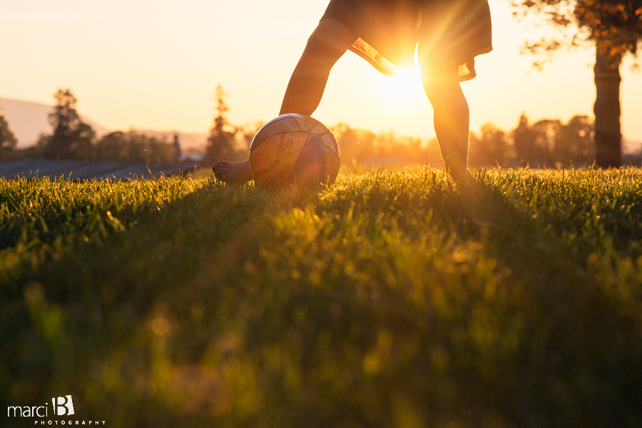 Soccer at sunset - girl playing soccer