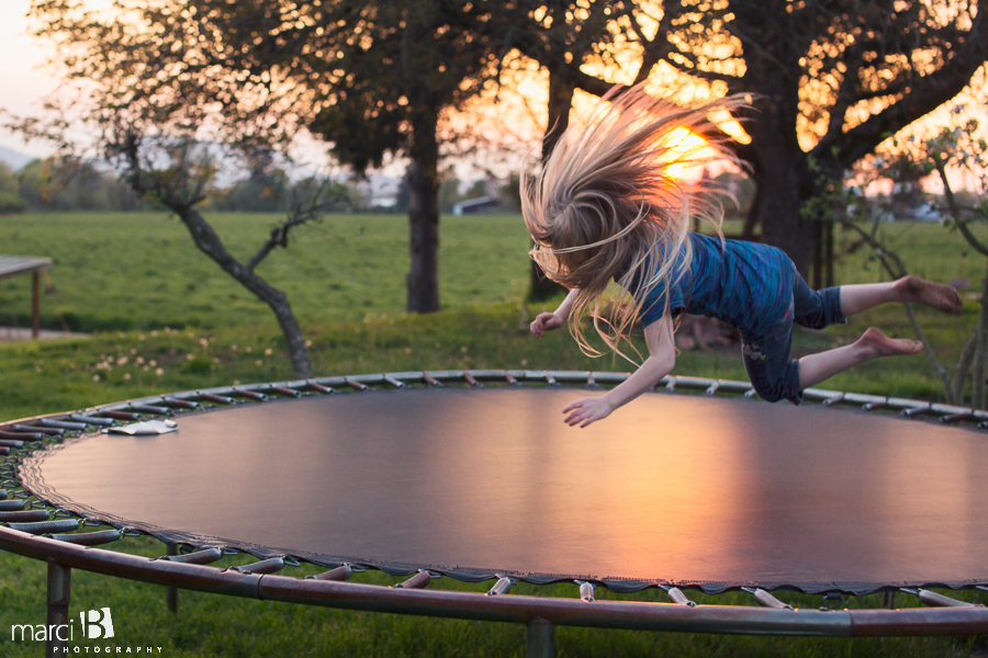 Girl on trampoline - children's lifestyle photography