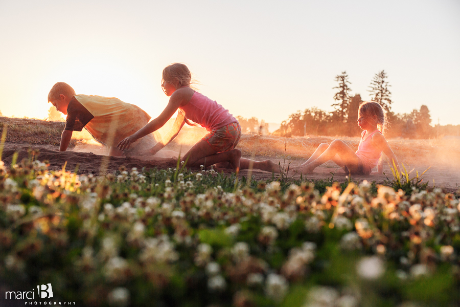 kids playing at sunset - kids on the farm