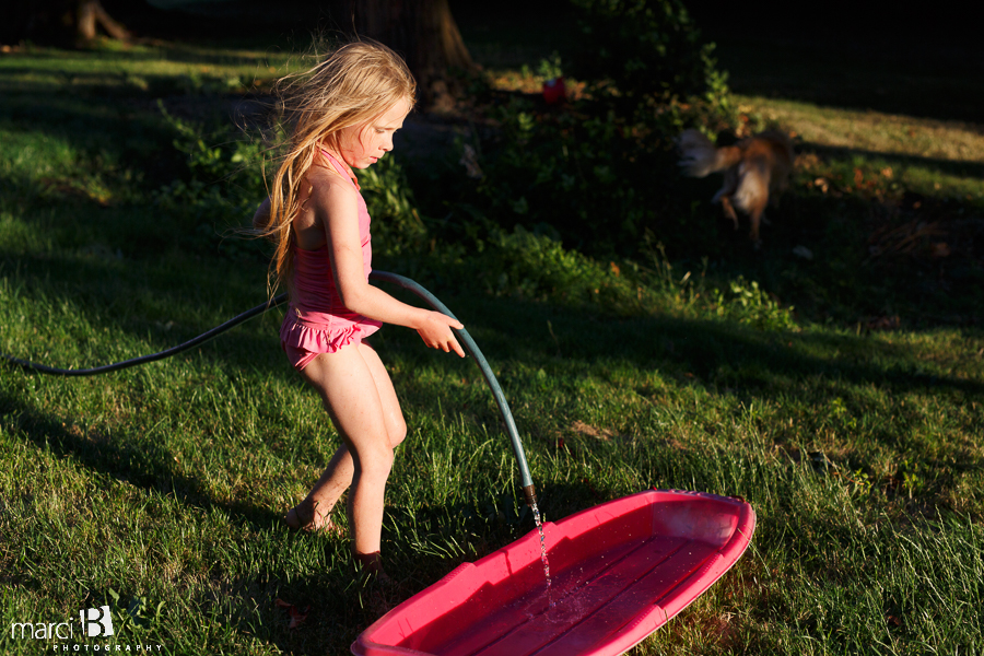 girl playing with water 