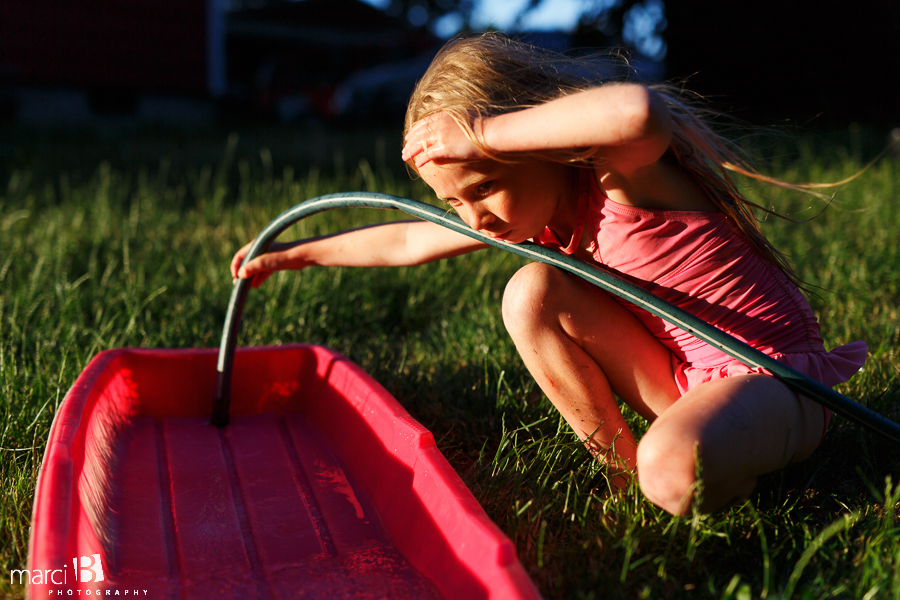 girl playing with water 