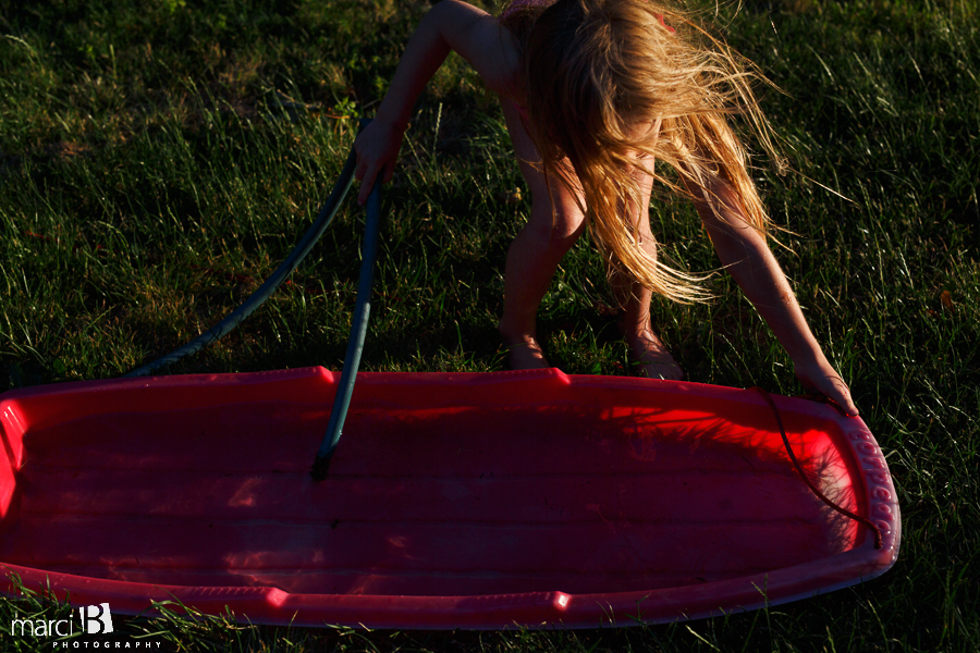 girl playing with water 