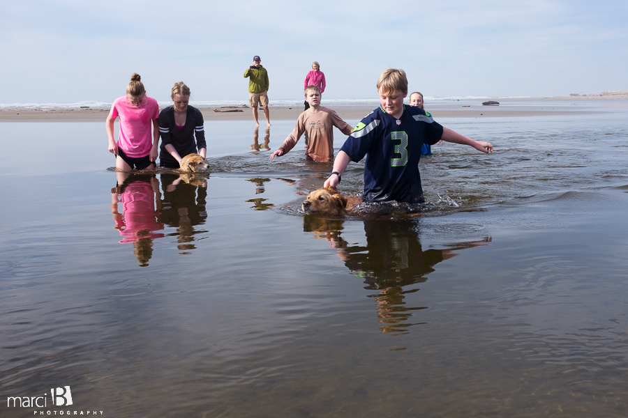 Oregon coast - kids at the beach - dog at the beach - puppy learning to swim