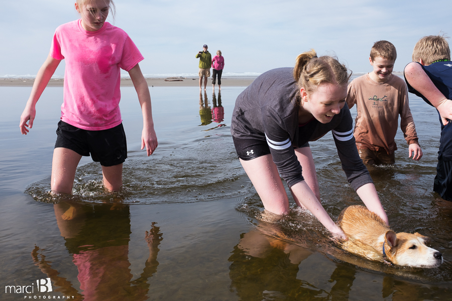 Oregon coast - kids at the beach - dog at the beach - puppy learning to swim