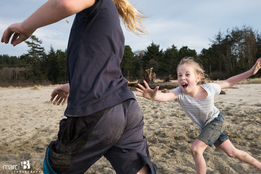 Oregon coast - kids at the beach - kids playing tag