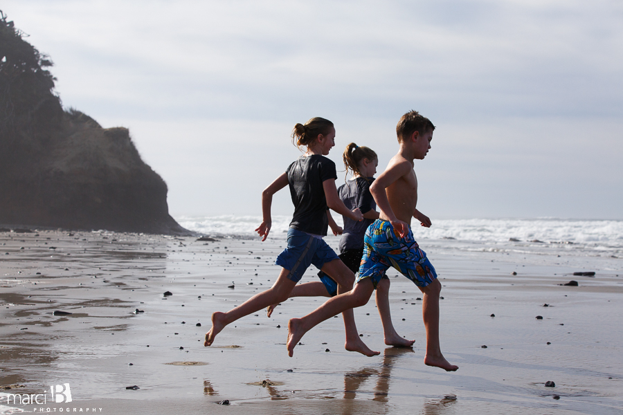 Oregon coast - kids at the beach - kids running on the beach